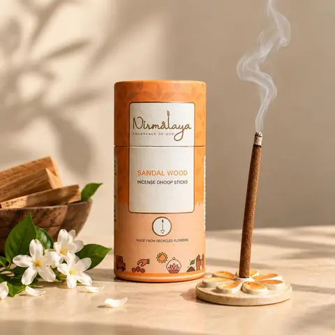 The sandalwood tube with a stick burning on the stand