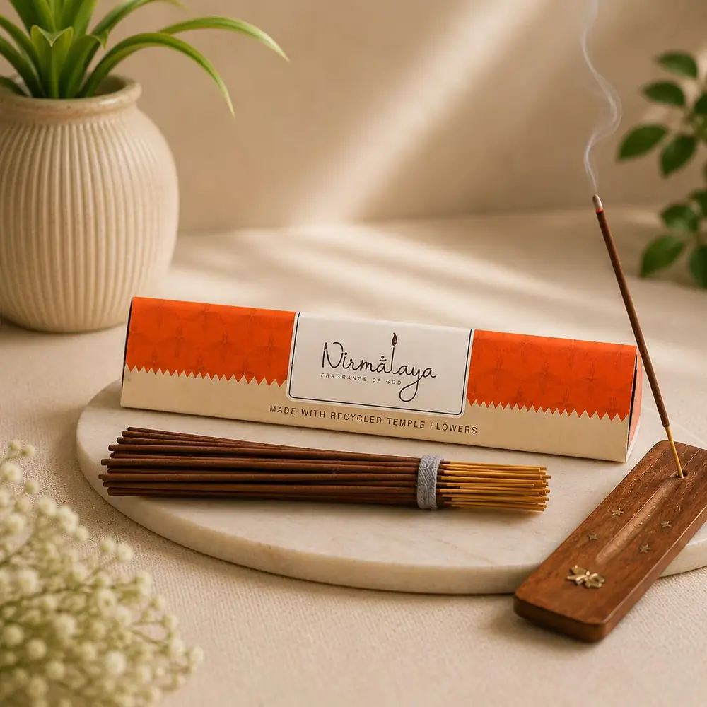 The Nirmalaya sandalwood box with sticks and a holder