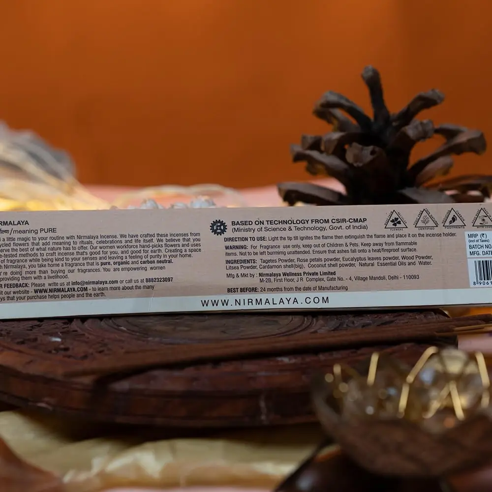 A close view of the box and sticks on dark wood
