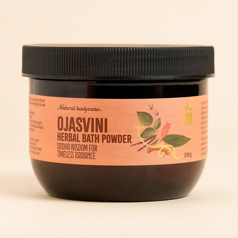 Ojasvini bath powder jar beside a wooden slice of yellow powder