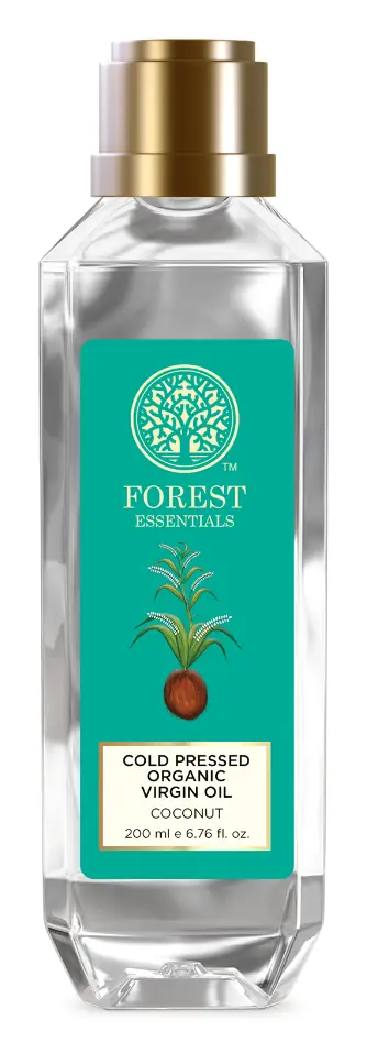 Bottle of cold pressed coconut oil on white