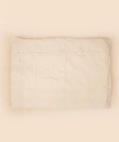 Folded mat in its cream cover from another angle