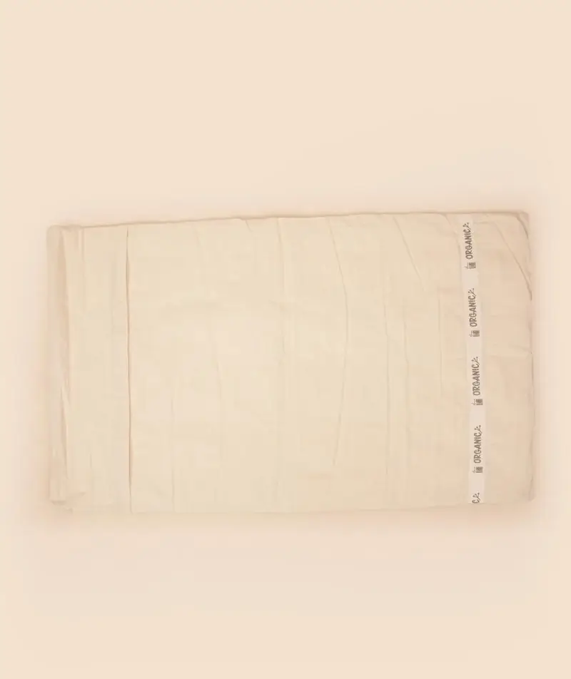 Cream organic cotton meditation mat laid flat