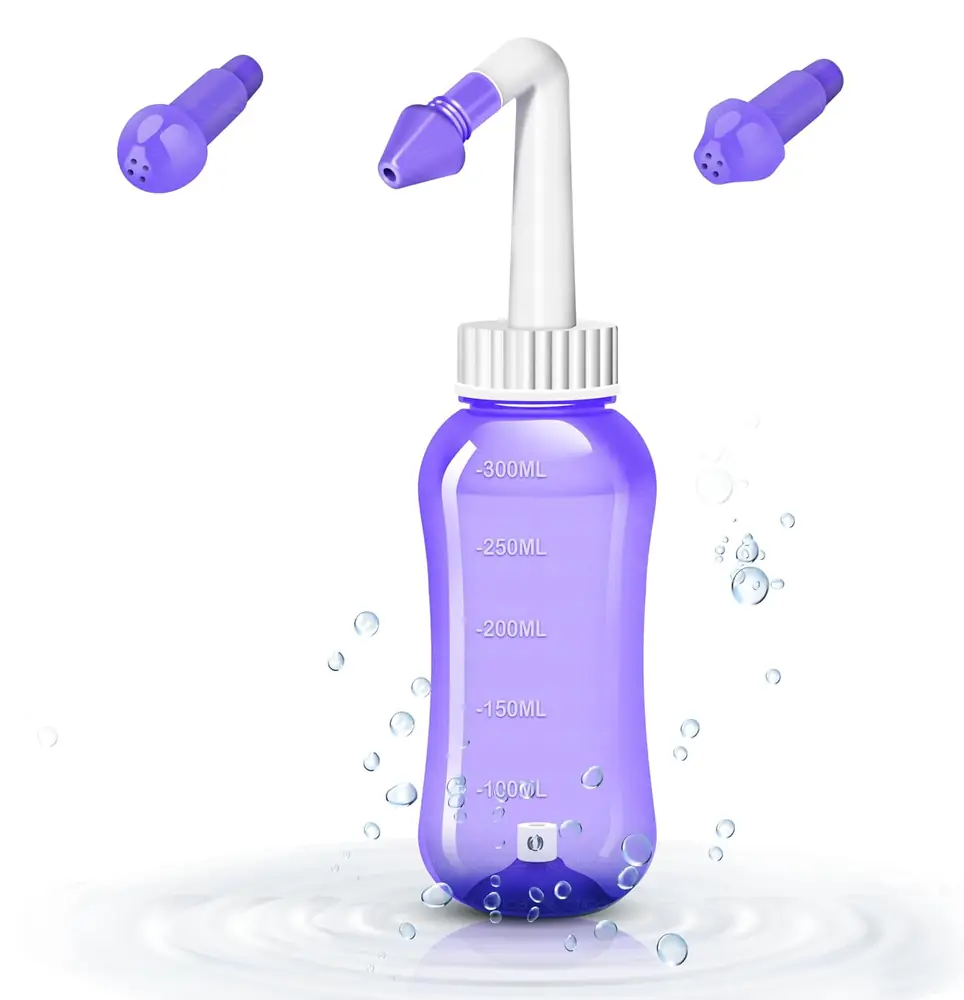 Violet blue neti bottle with a white nozzle and three spare tips