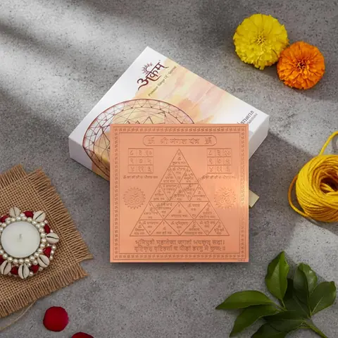 The yantra in its box with flowers