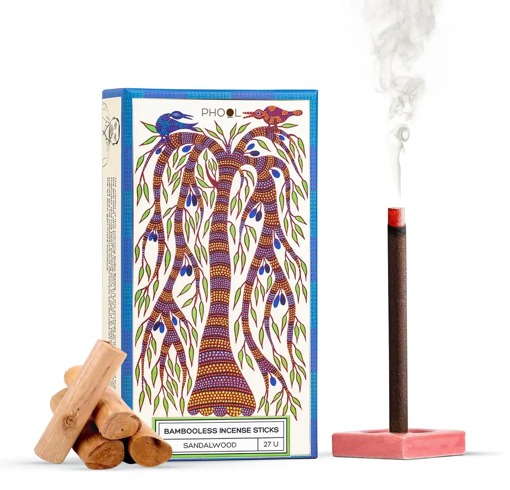 The Phool sandalwood box with a burning stick on a stand