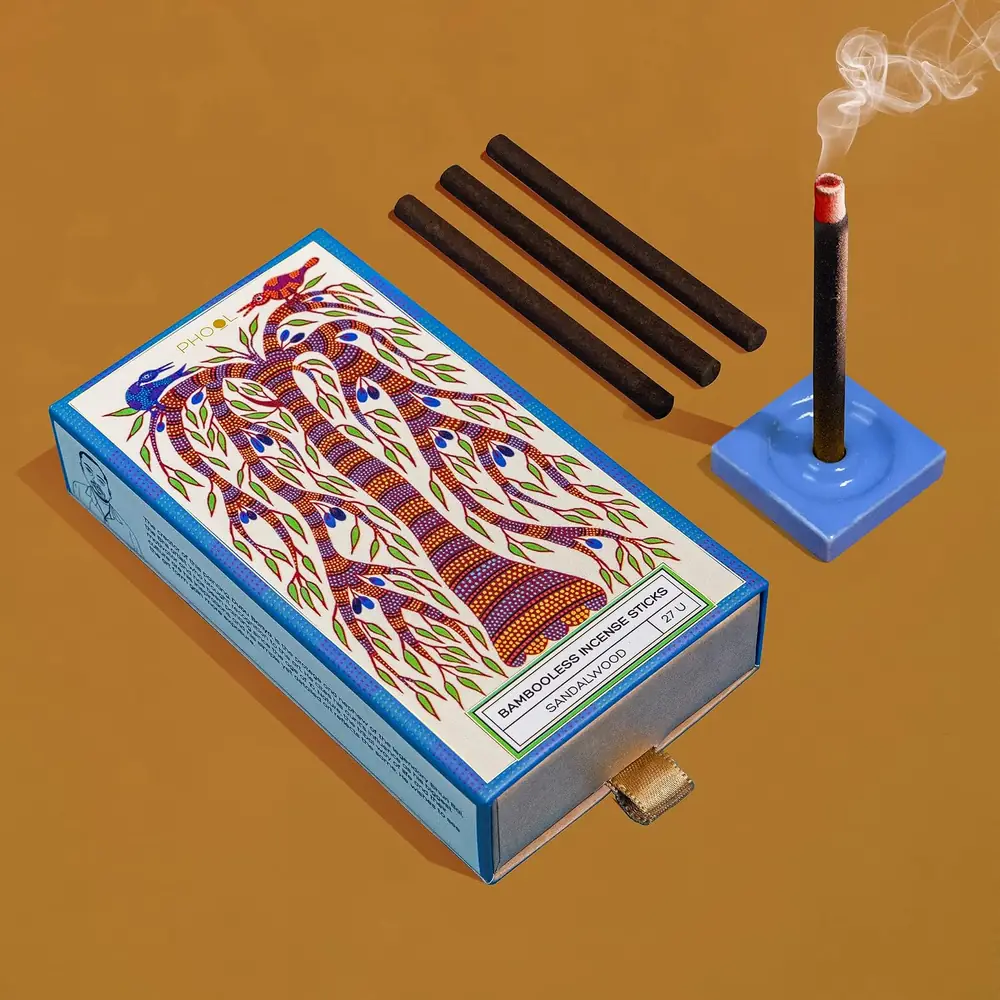 The box with sticks laid out beside it
