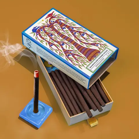 The box and open drawer with sticks