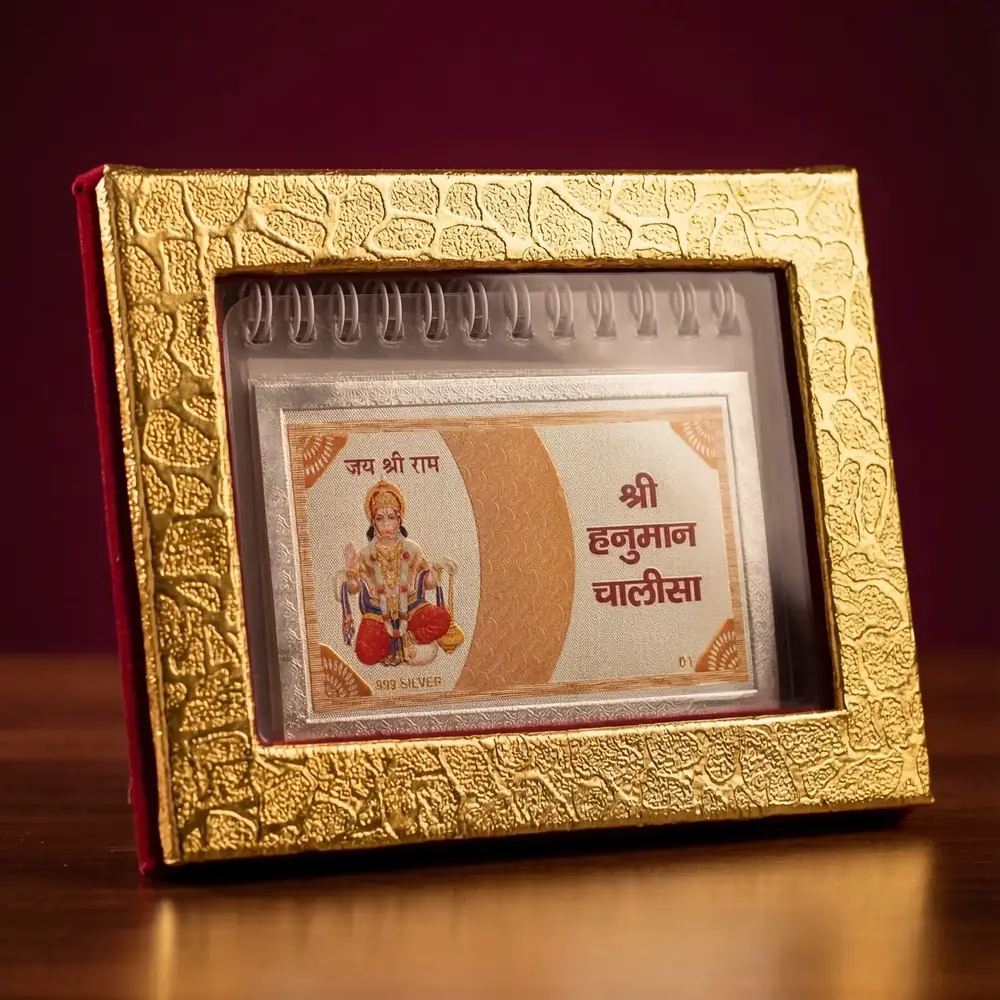 Flip book in a gold-toned frame with Hanuman on the cover
