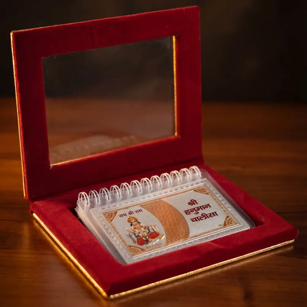 The flip book in an open red velvet-lined box
