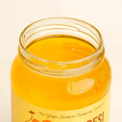 Close view of the gold lid and the ghee