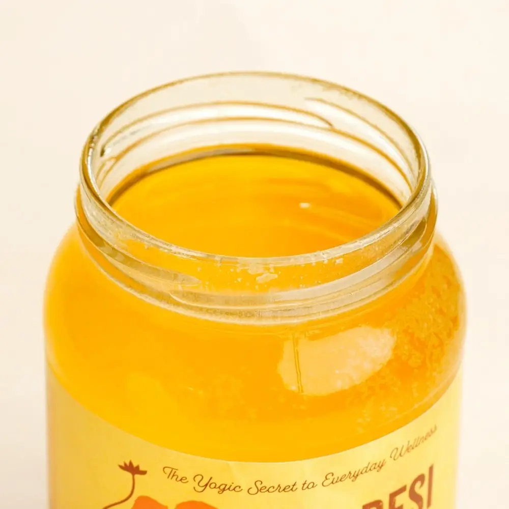 Close view of the gold lid and the ghee