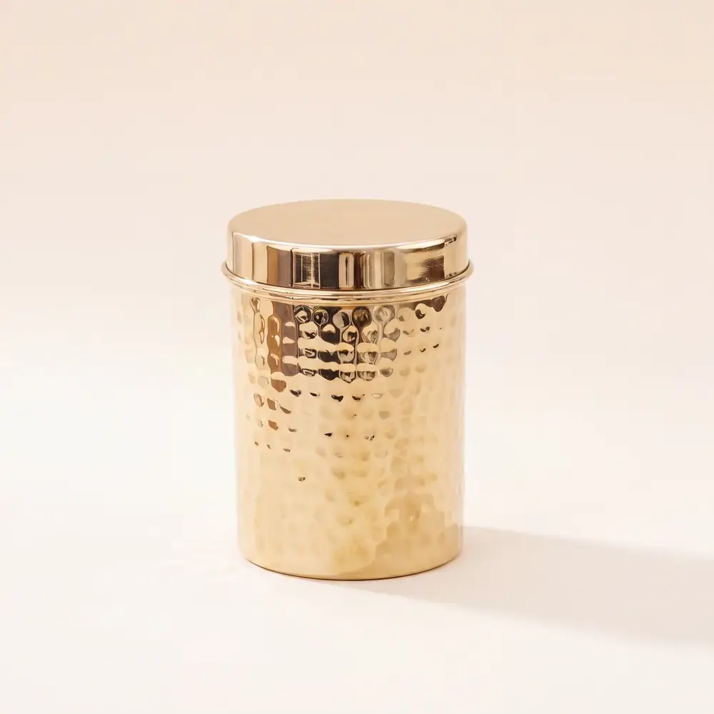 Hammered brass canister with its lid on