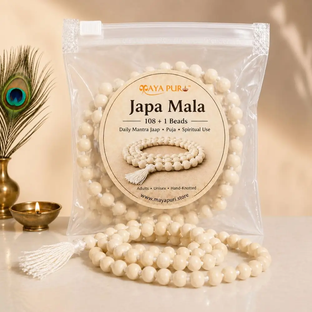 The tulsi mala in its zip pouch with a peacock feather