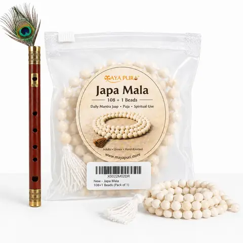 The mala in its pouch beside a flute