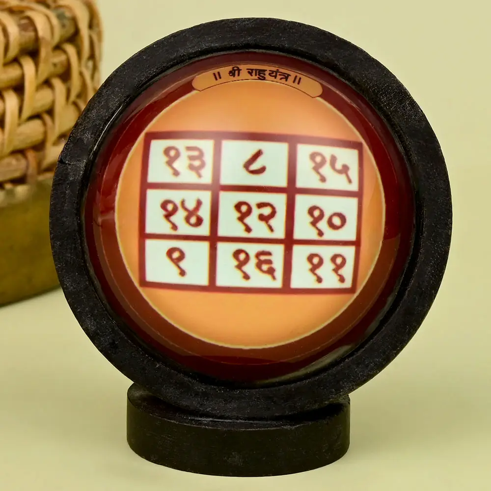 Rahu yantra grid in a round wooden frame on a stand