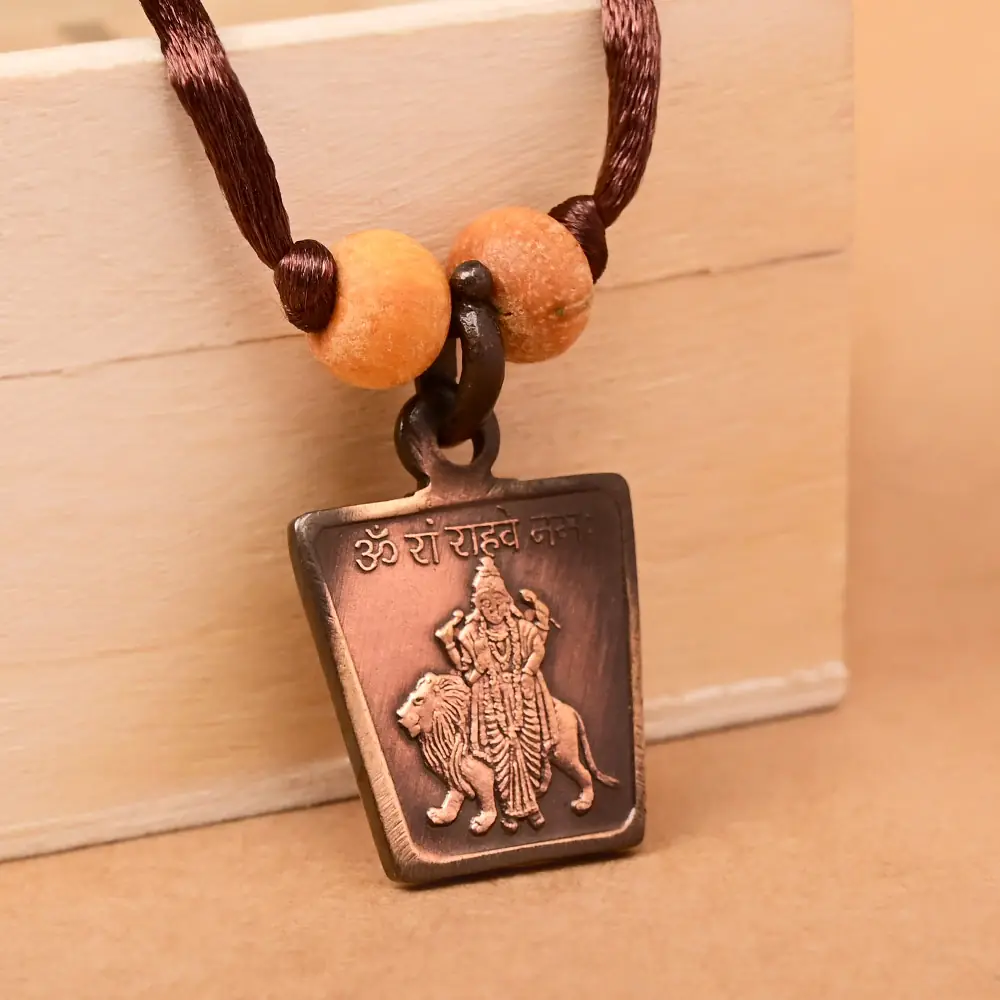 The deity side on a brown cord with two beads