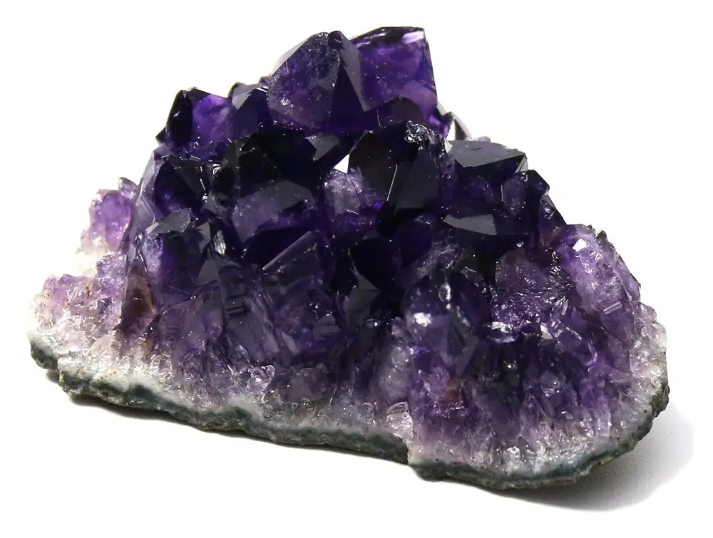 Raw amethyst cluster with deep purple crystal points