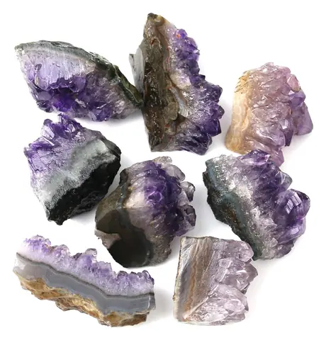 Several raw amethyst pieces laid out together