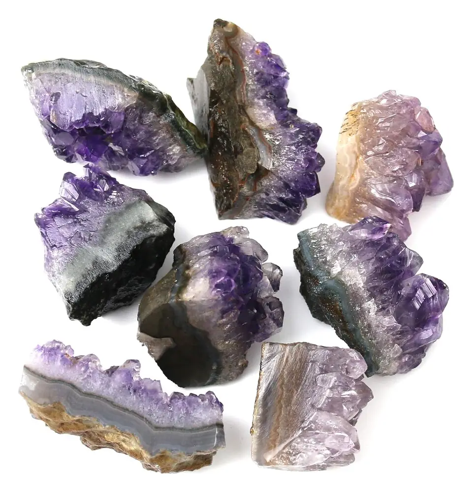 Several raw amethyst pieces laid out together