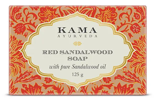 Orange and red box of Kama red sandalwood soap with the bar beside it