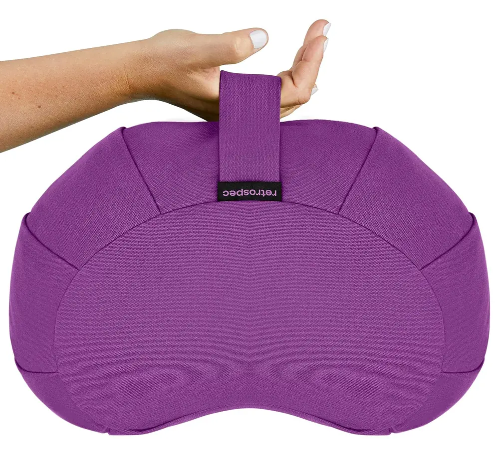 The cushion with a hand pressing the carry handle