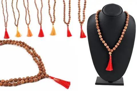 The mala on a mannequin bust beside other tassel colours