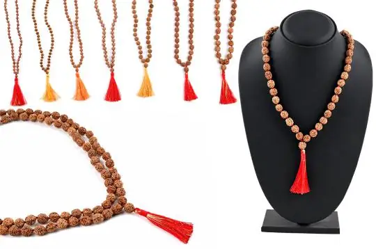 The mala on a mannequin bust beside other tassel colours