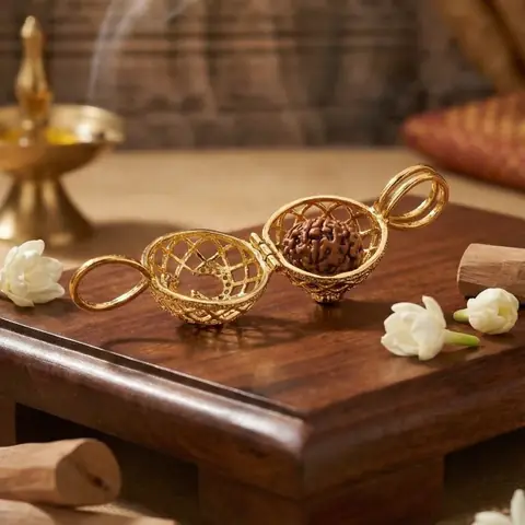 The pendant frame opened beside a rudraksha bead