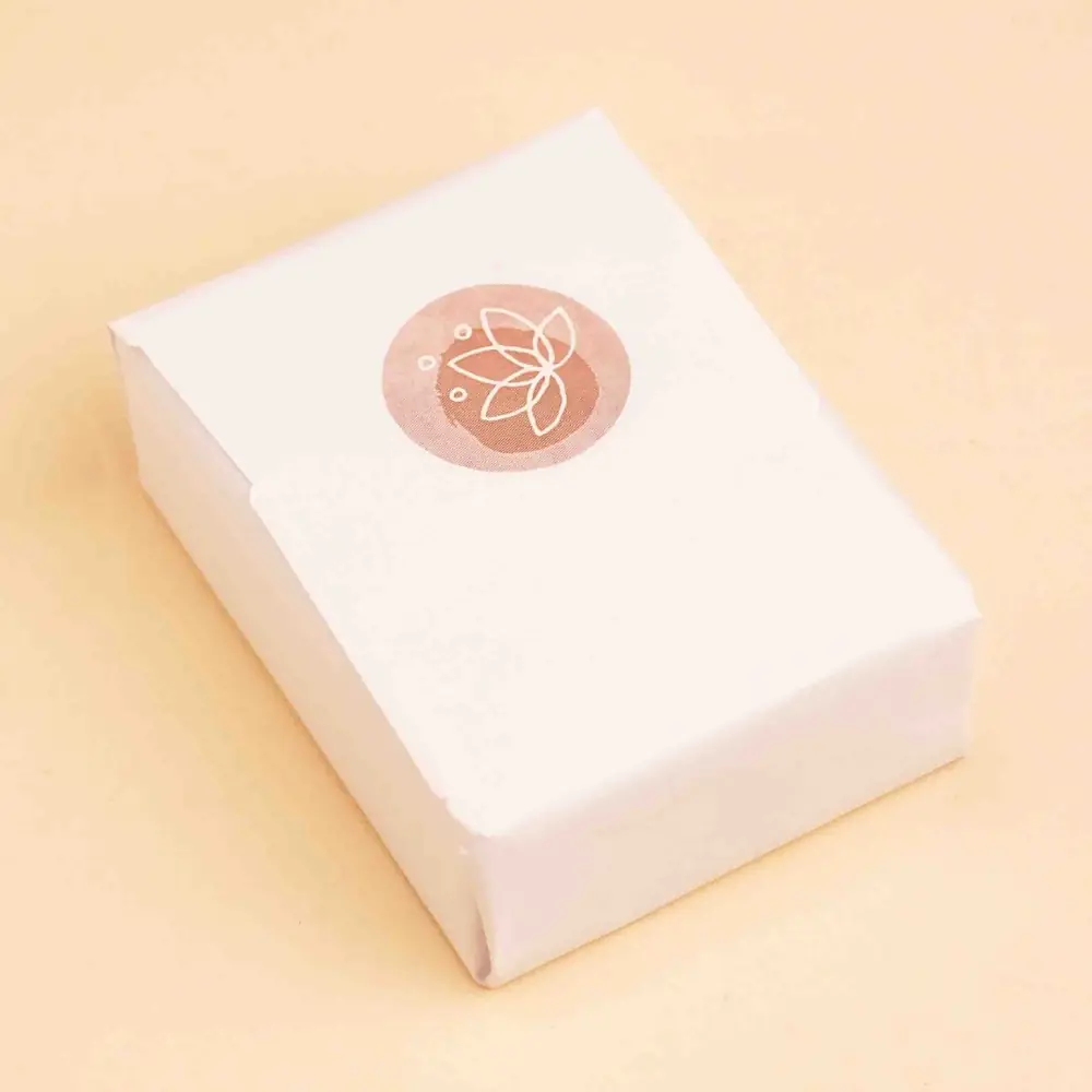 The soap bar in its white wrapper
