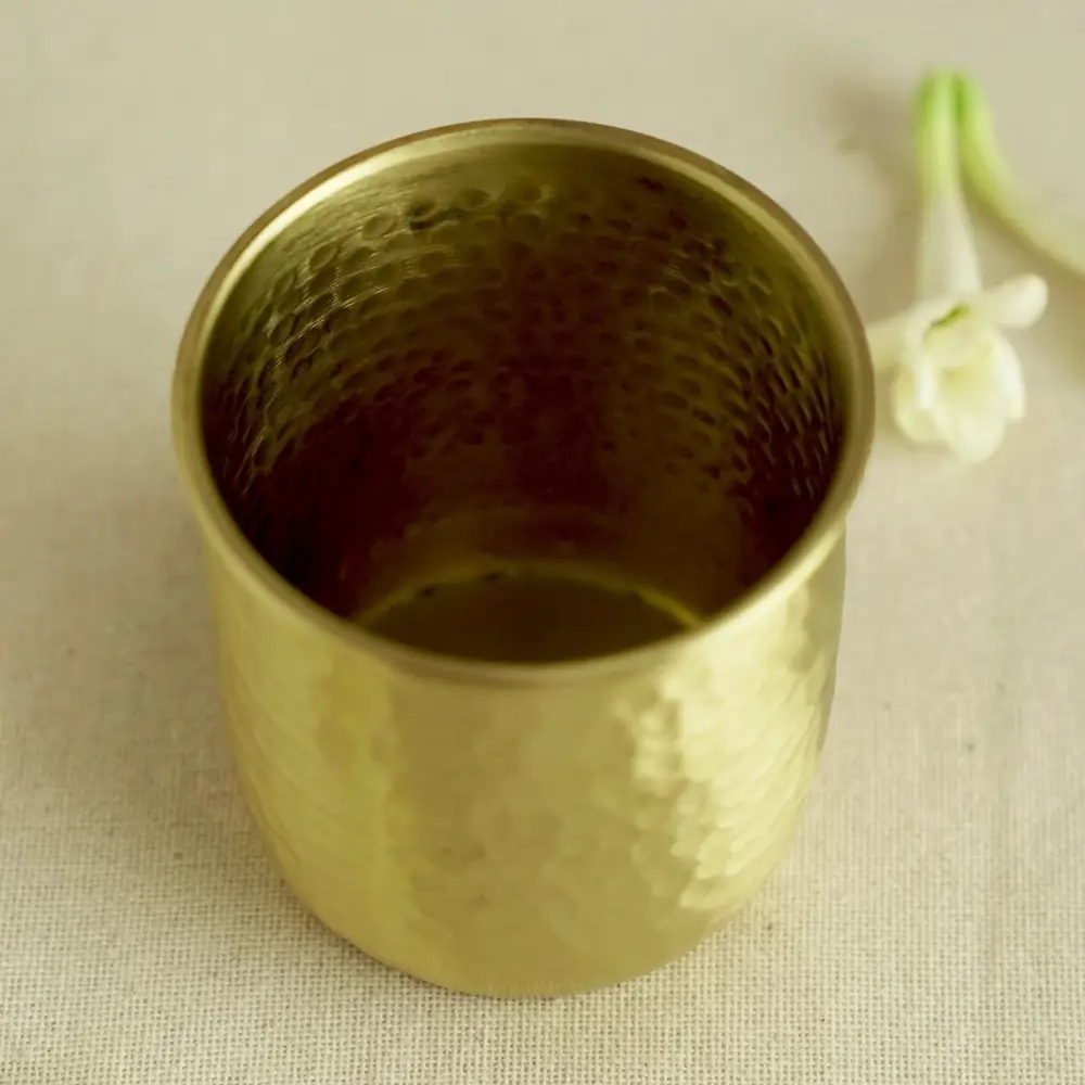 Hammered brass glass seen from the side
