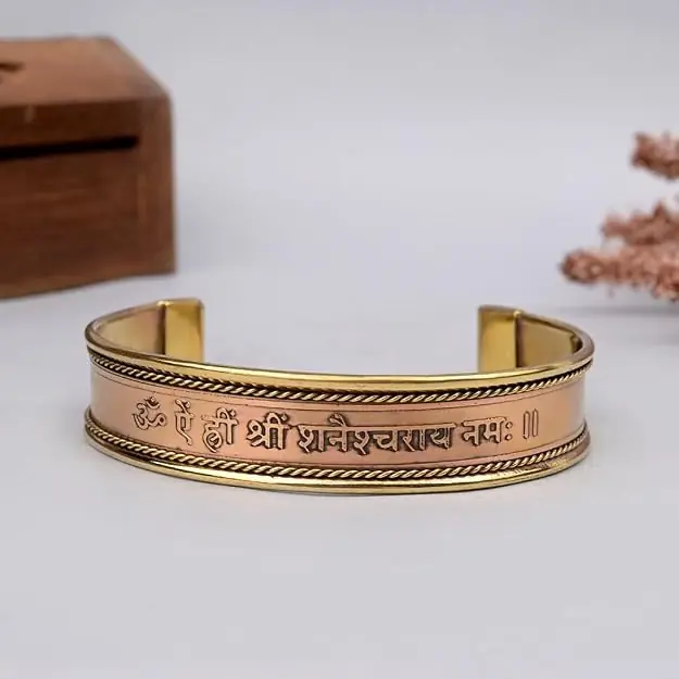 Front of the kada showing the raised Shani mantra