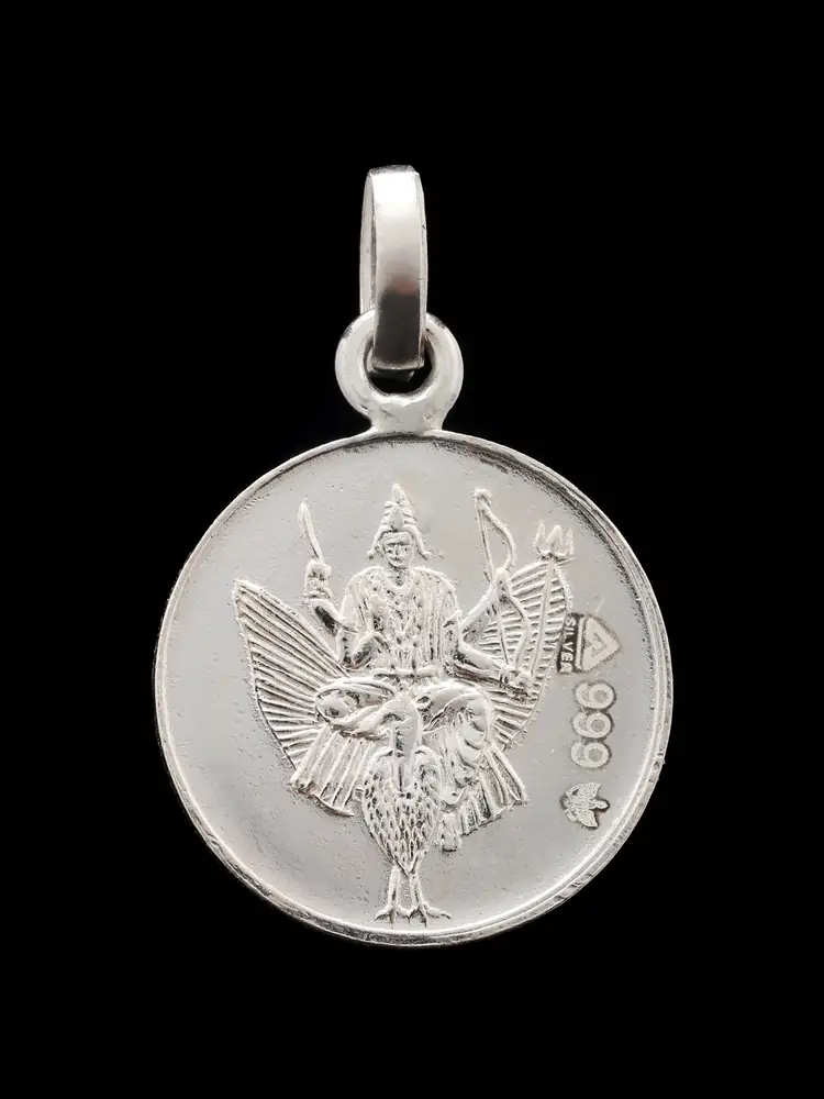Silver Shani pendant, close view of the figure face