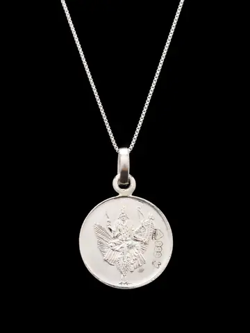 The pendant hanging on a thin chain, figure face