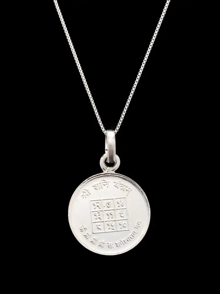 The pendant on a chain showing the yantra face