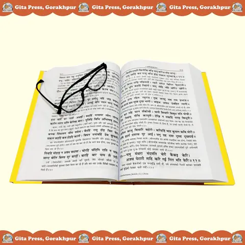 The open book with reading glasses on the page