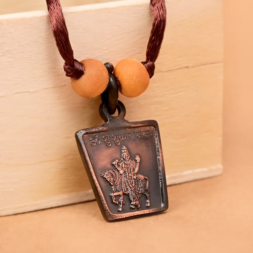 The deity side on a brown cord with two beads