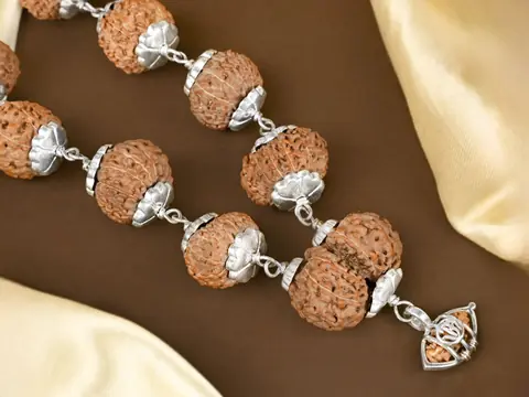 Close view of silver capped rudraksha beads
