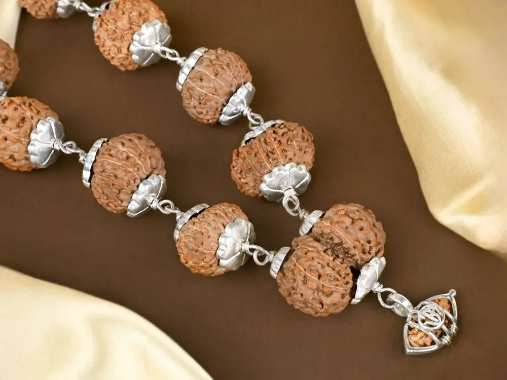 Close view of silver capped rudraksha beads