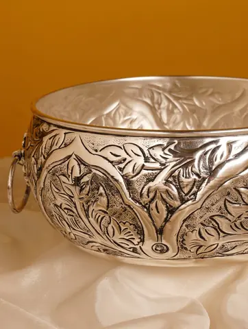 Close view of the etched floral work and a ring handle