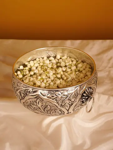 The urli filled with small white flower buds