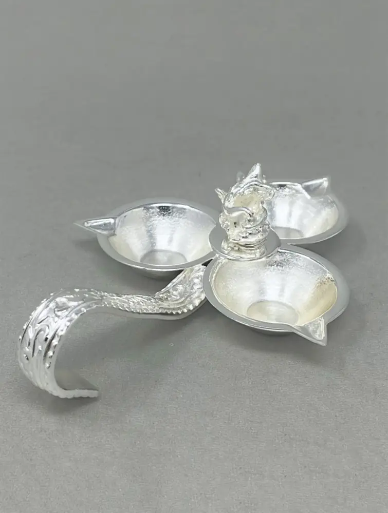 Silver-finish lamp bowls with a curved handle on flower petals