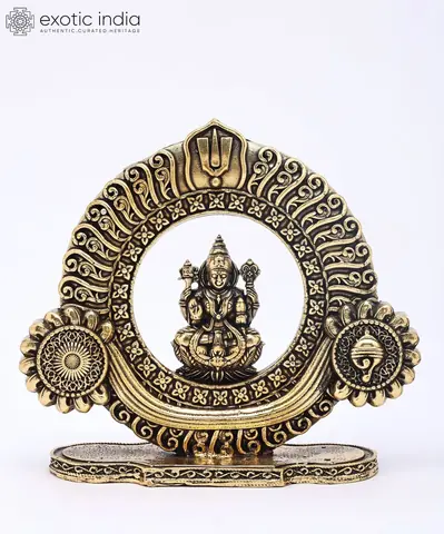 Lakshmi in her round carved frame