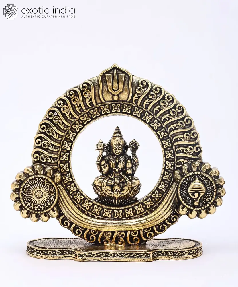Lakshmi in her round carved frame