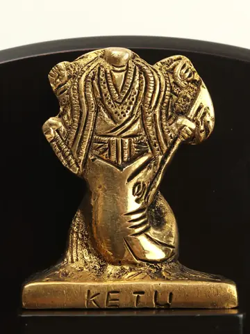 Ketu figure with the name on its base
