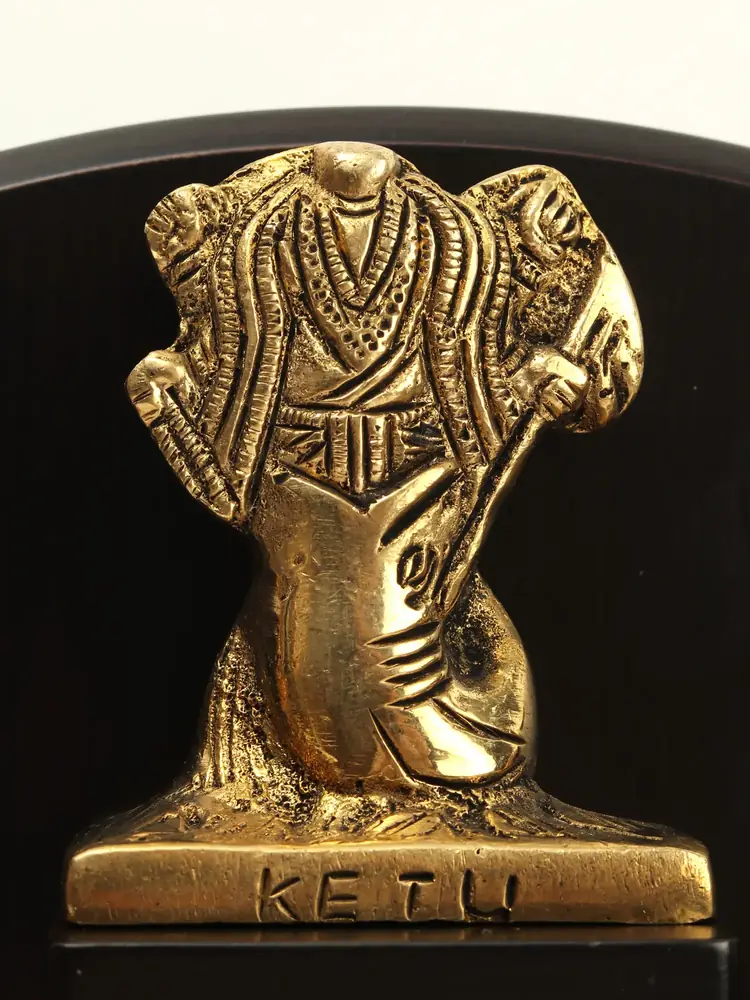 Ketu figure with the name on its base