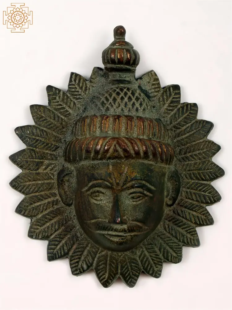 Brass Surya wall hanging in dark green patina