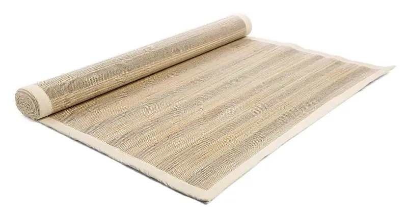 Straw and jute yoga mat rolled up