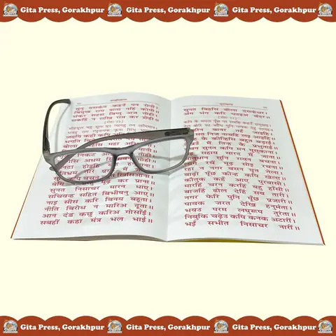 Open book with reading glasses resting on the page