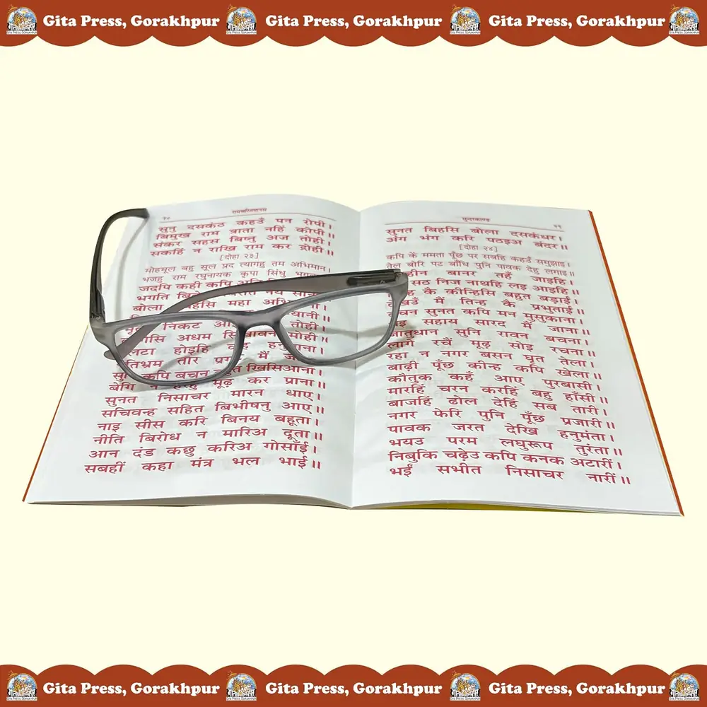 Open book with reading glasses resting on the page